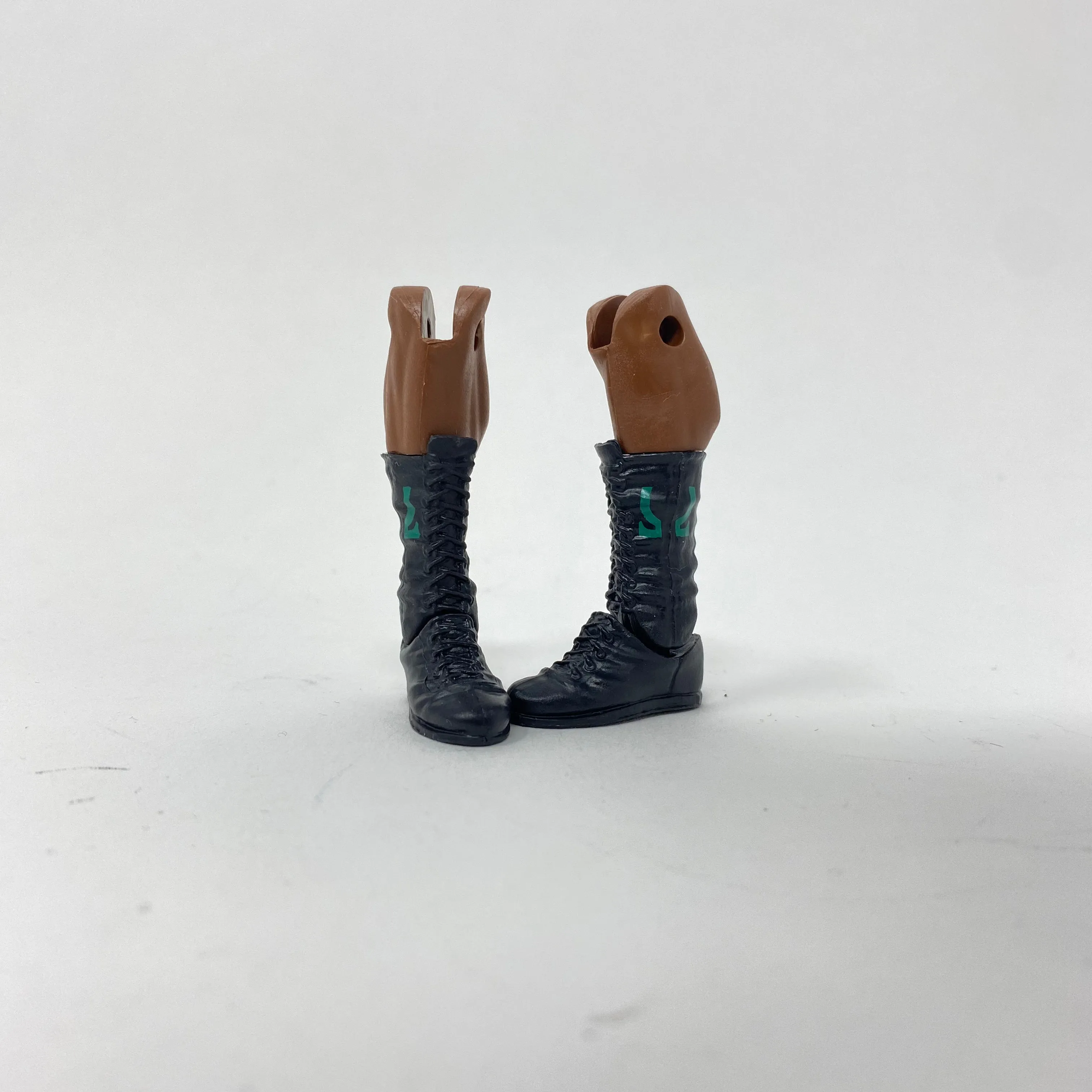 Black Laced Boots with Green Design on Side on Ebony Legs